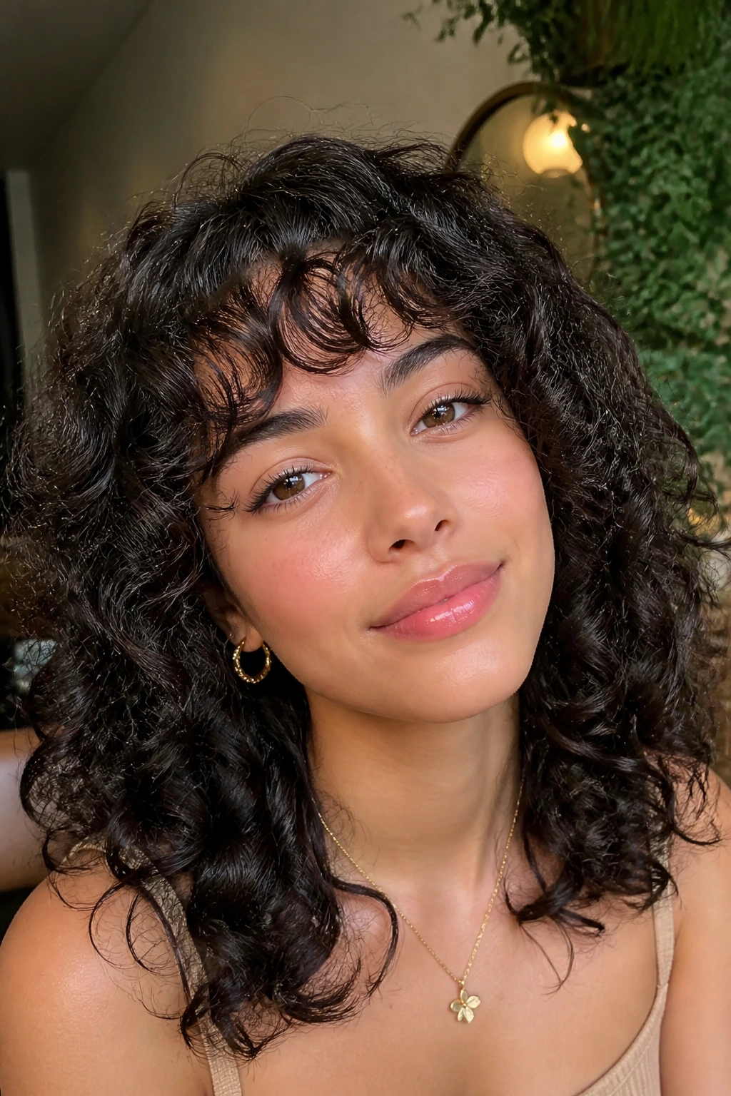Close-up of a person with arched bangs tracing the brow shape.