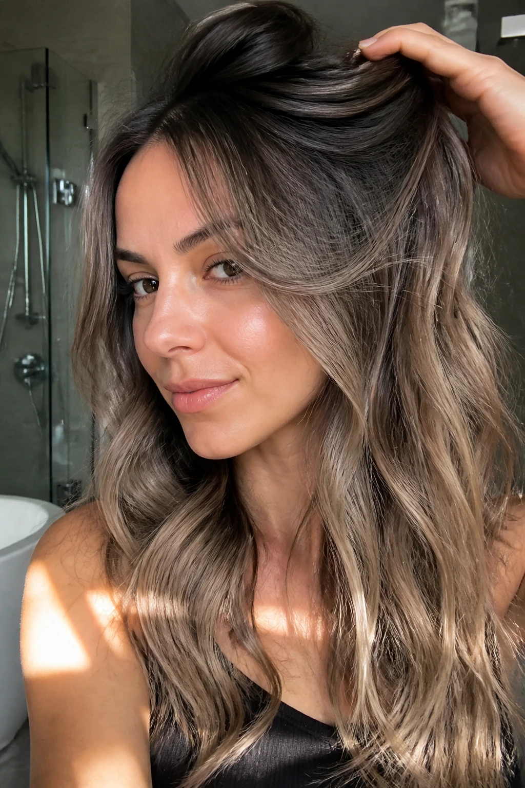 Close-up of a real woman with ash-taupe teasy-lights and soft gradient