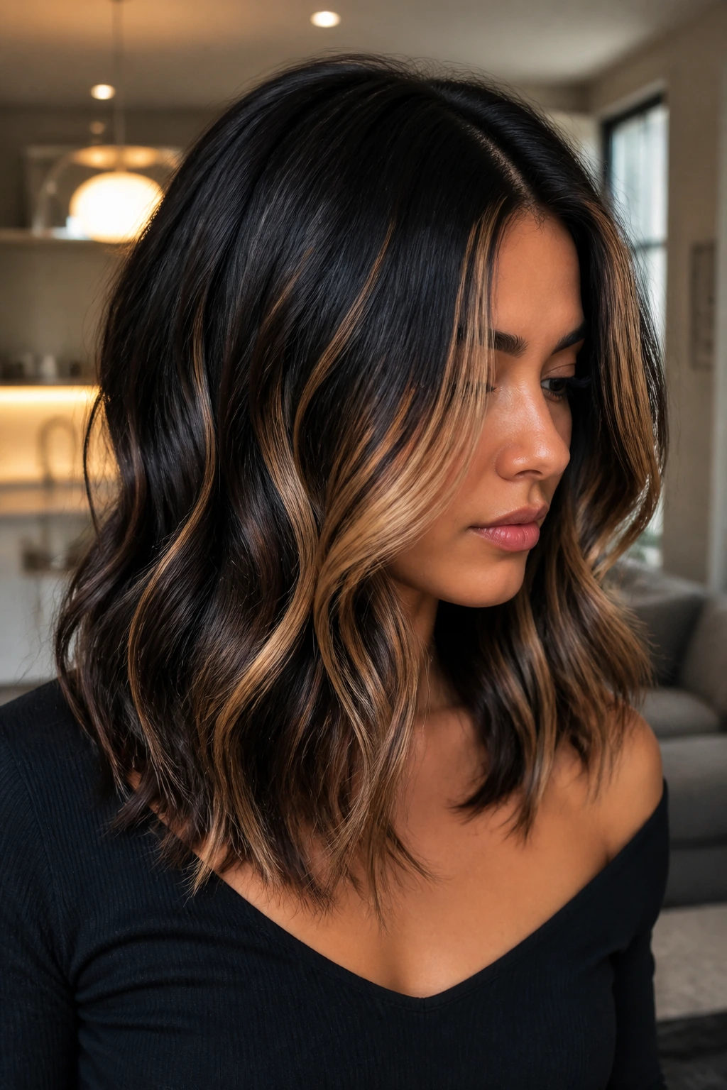 Portrait of a real person with high-contrast balayage on black-brown hair.