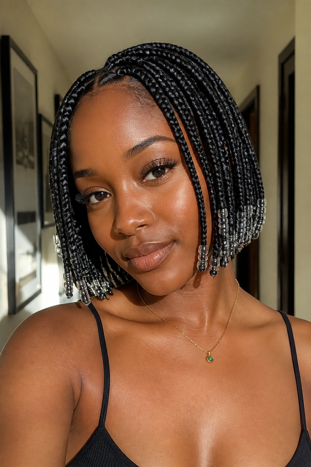 Close-up of a real Black woman with beaded bob braids