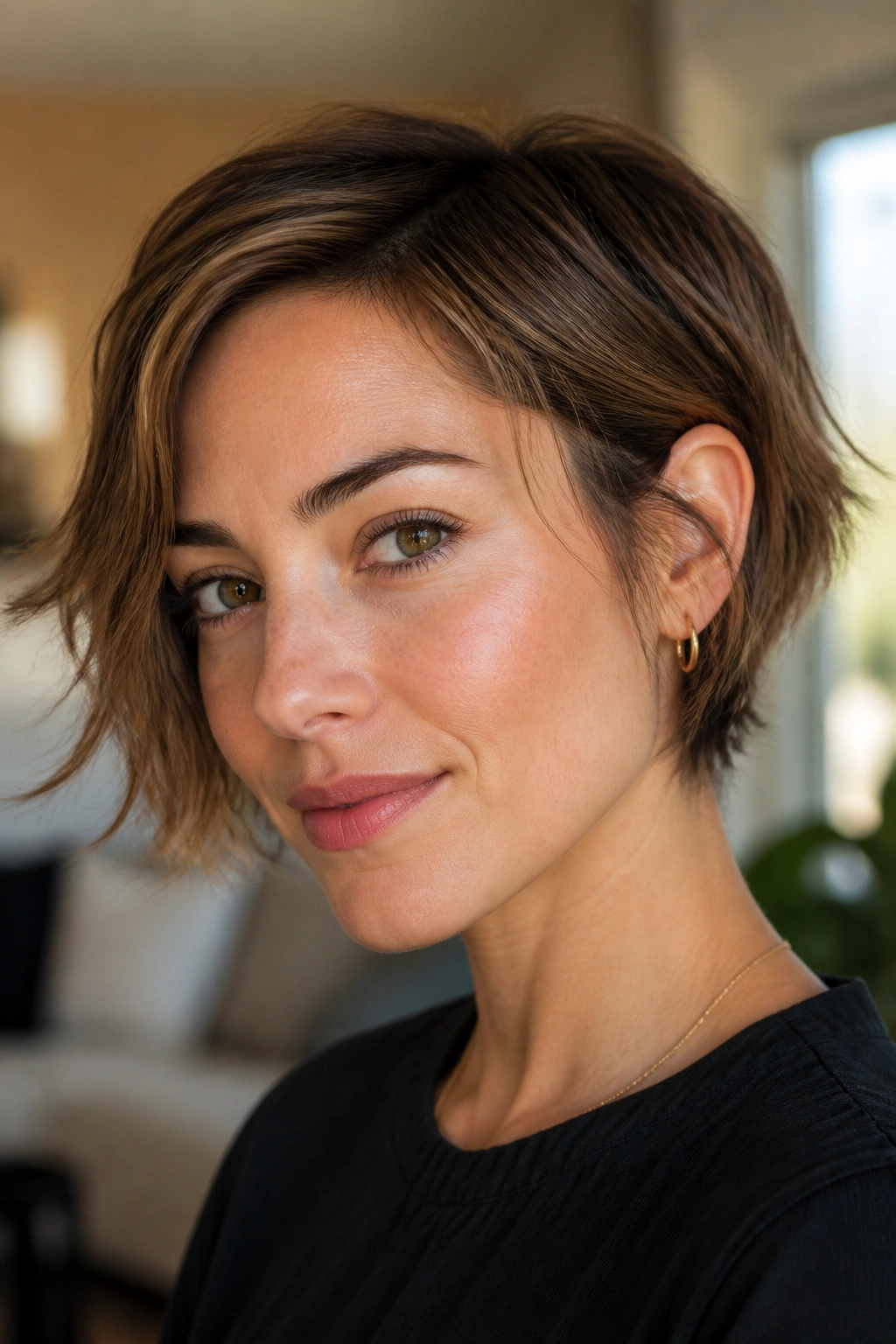Real woman portrait with bixie cut between cheekbone and jaw