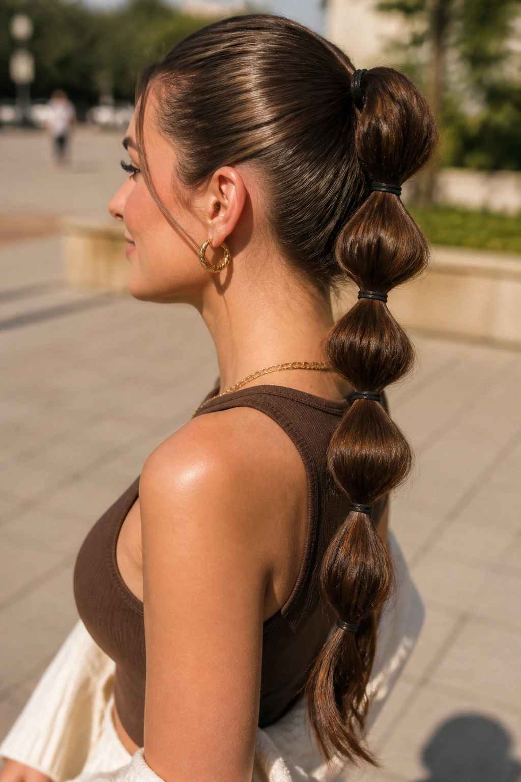 Real woman with bubble ponytail showing clear elastic segments