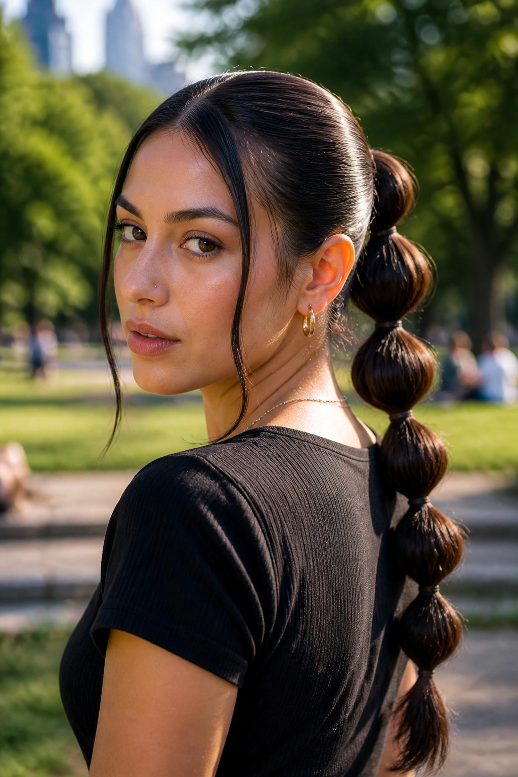 Three-quarter view of bubble ponytail with middle part on a real person