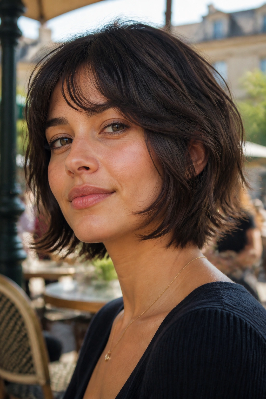 Close-up of a real person with a chin-length wolf cut hugging the jawline outdoors