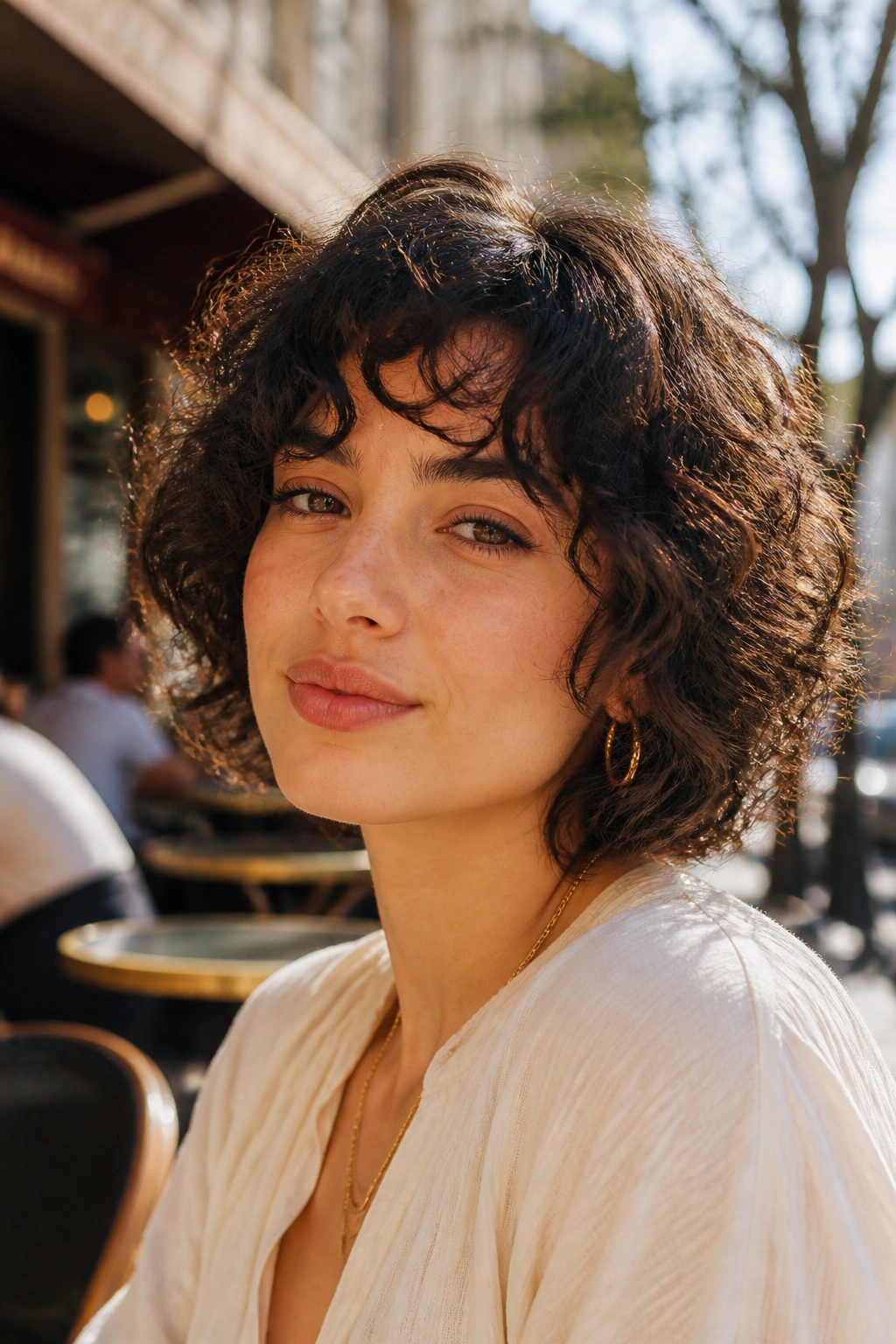 Portrait of a person with chin-length curly shag bob