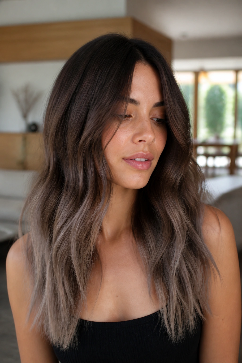 Brunette with cocoa base and ashy ends, soft cool tone at the ends.