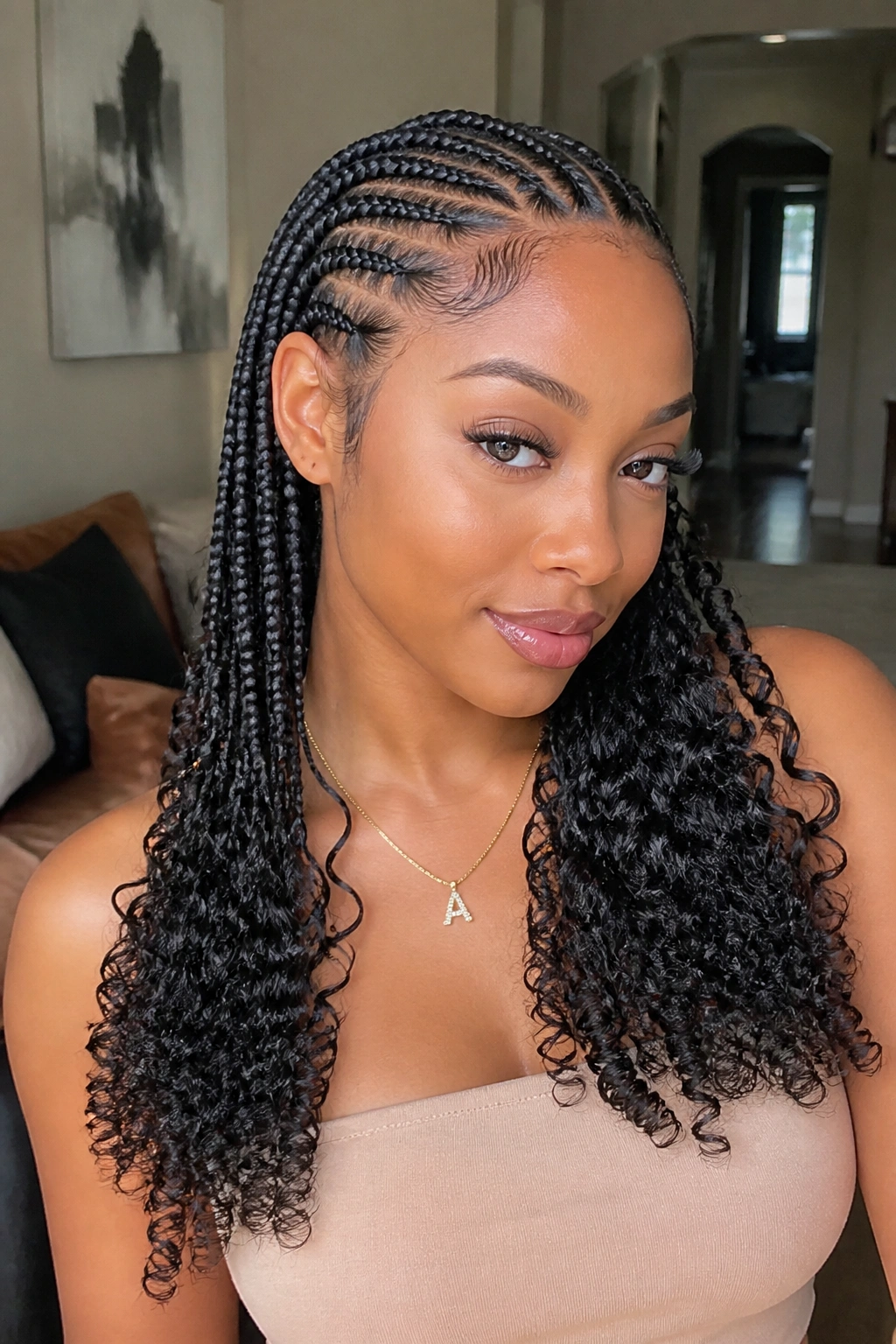 Real woman with feed-in braids transitioning into curly ends