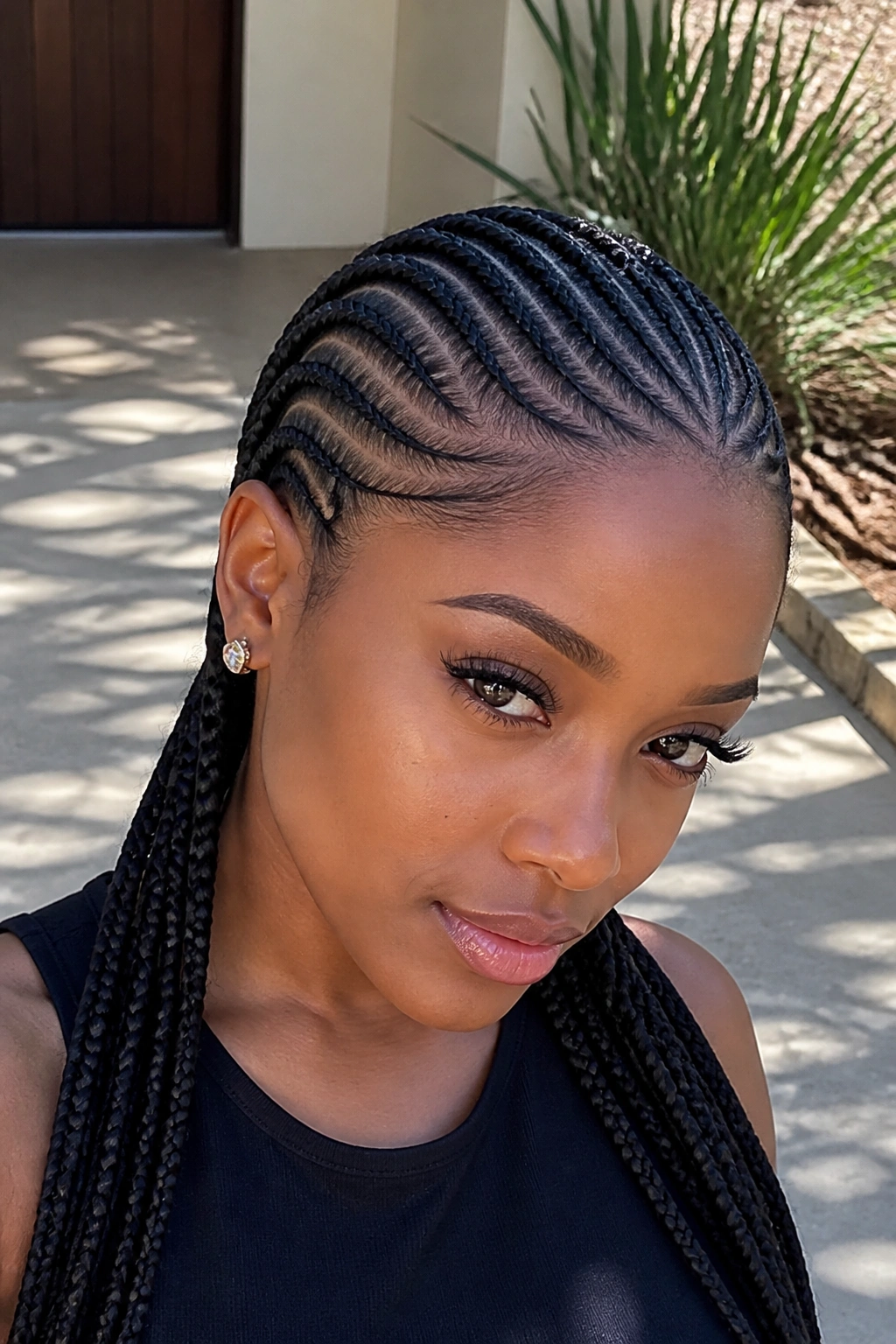 Real woman with curved cornrows following the head shape