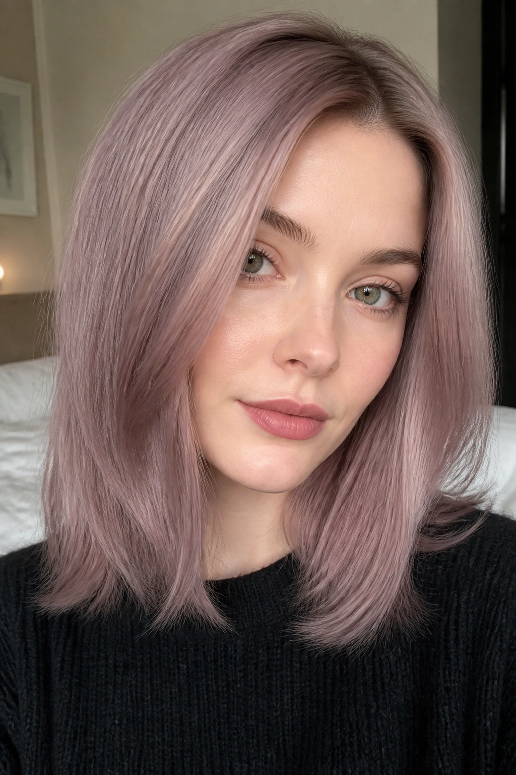 Close-up of a real woman with dusty mauve hair and pale blonde base under natural window light