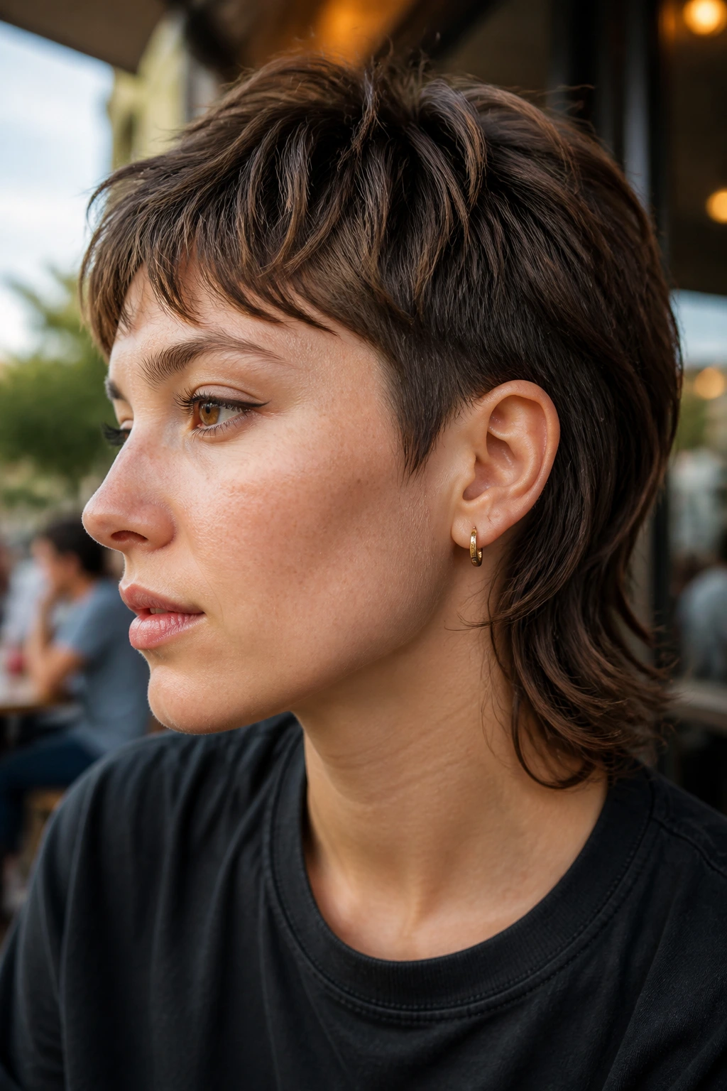Close-up of a real person with an ear-grazing mullet hairstyle