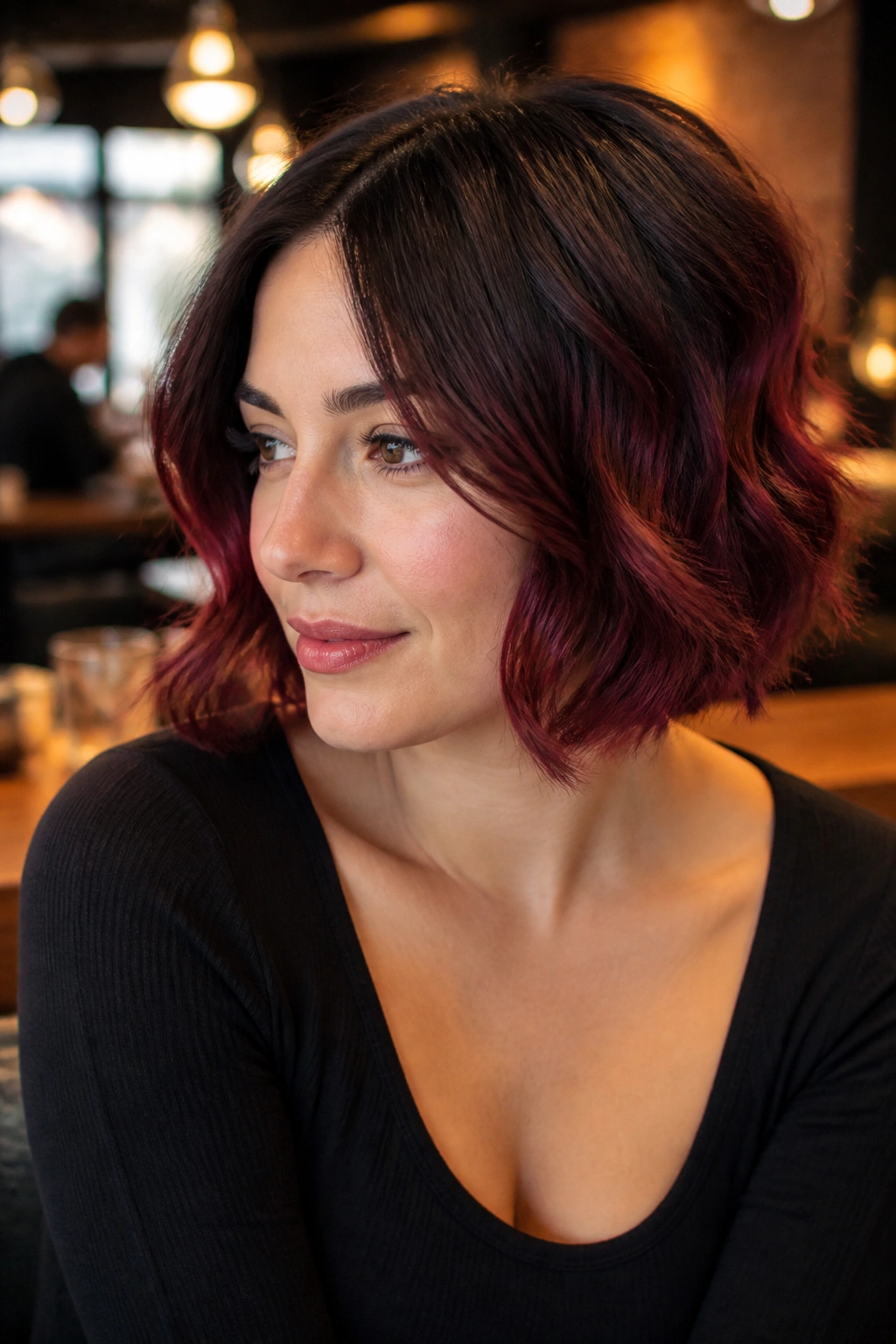Close-up of espresso to cherry cola ombre on short hair