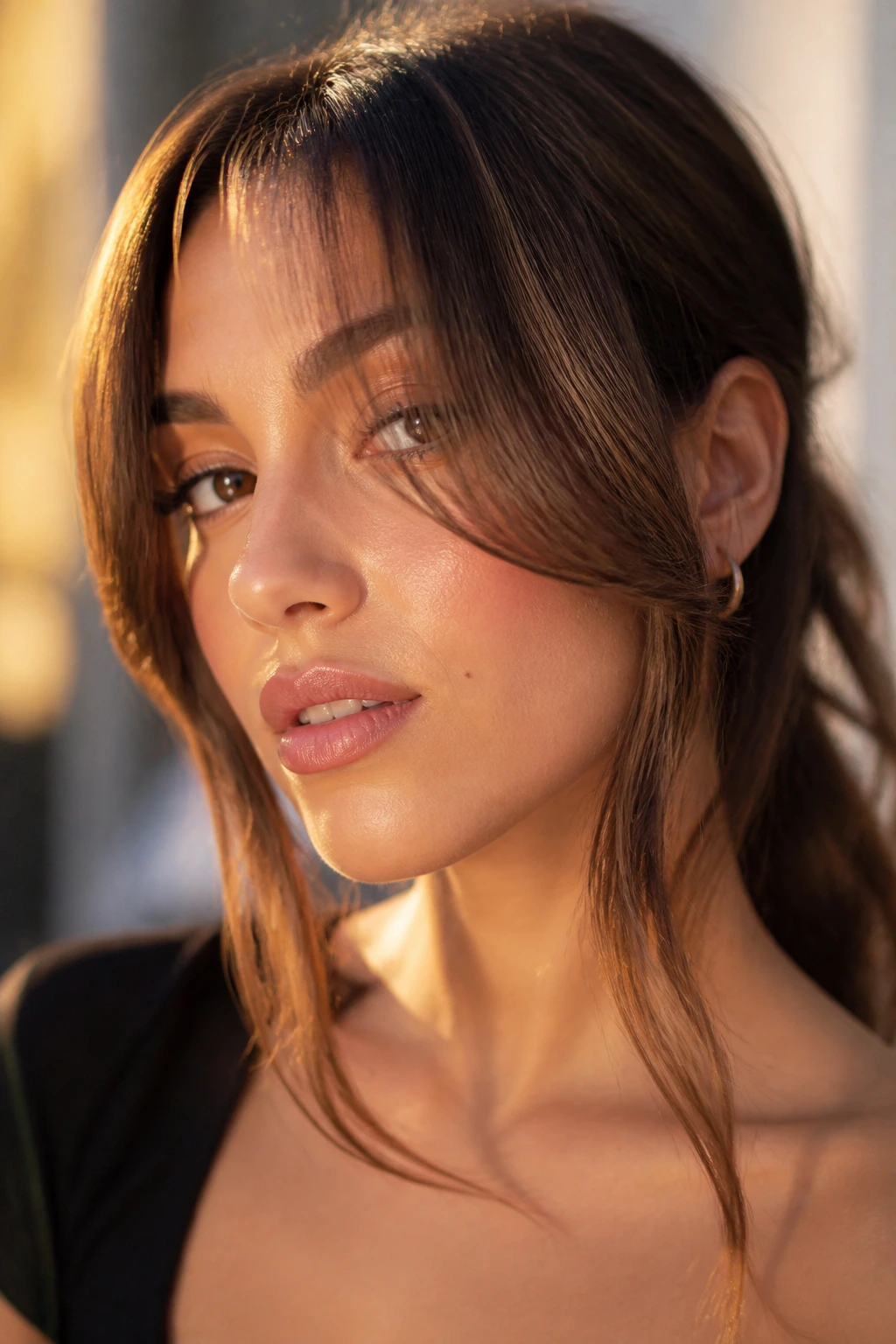 Close-up portrait of a real woman with extra-long draped curtain bangs