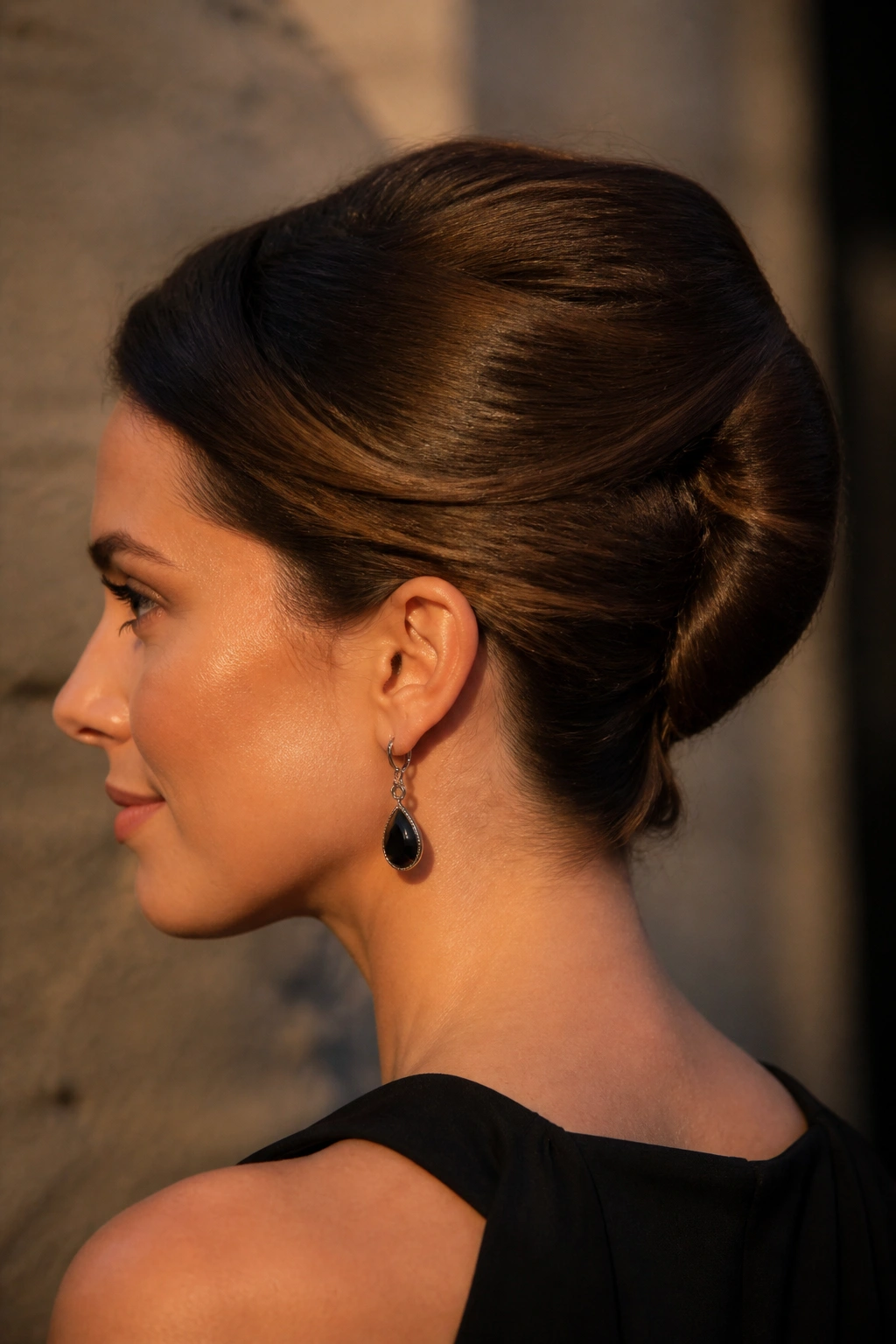 Close-up of a real woman with a French twist-inspired roll at the back of her head