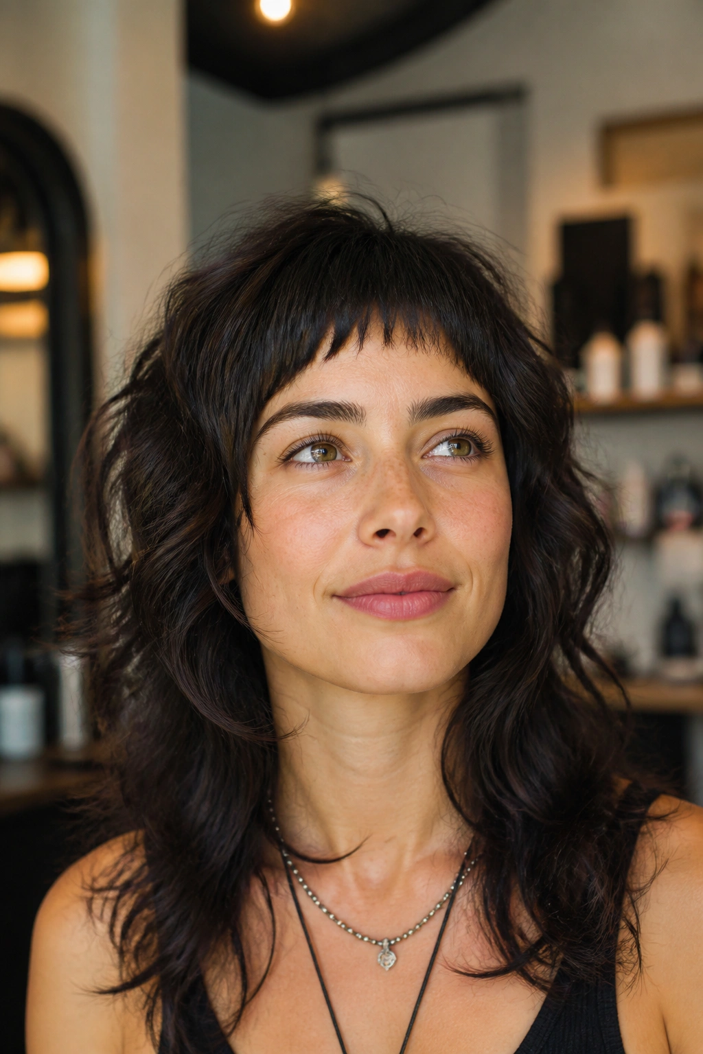 Close-up portrait of a real person with micro-bang wolf cut