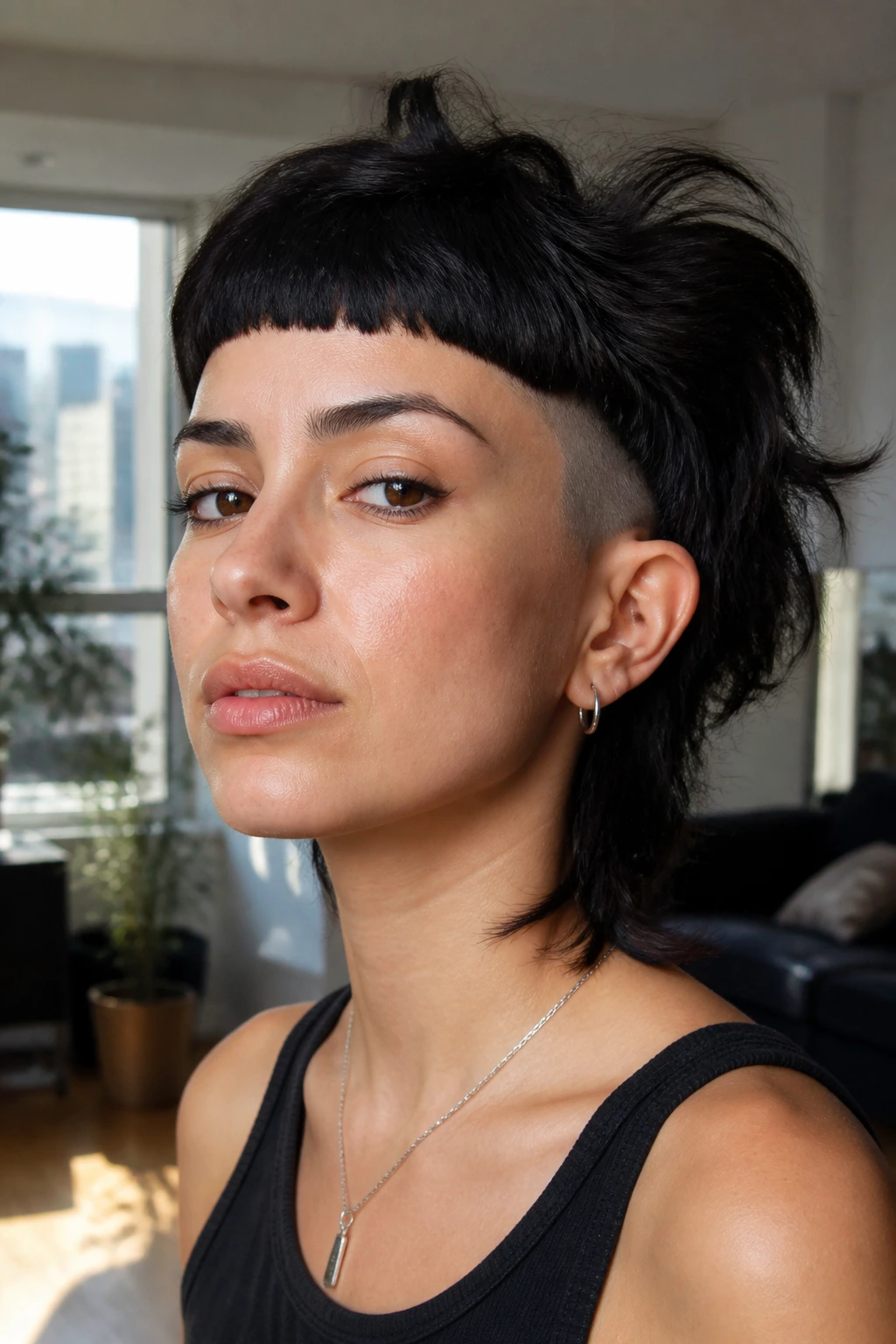 Portrait of a real person with micro bangs and undercut in a bright apartment