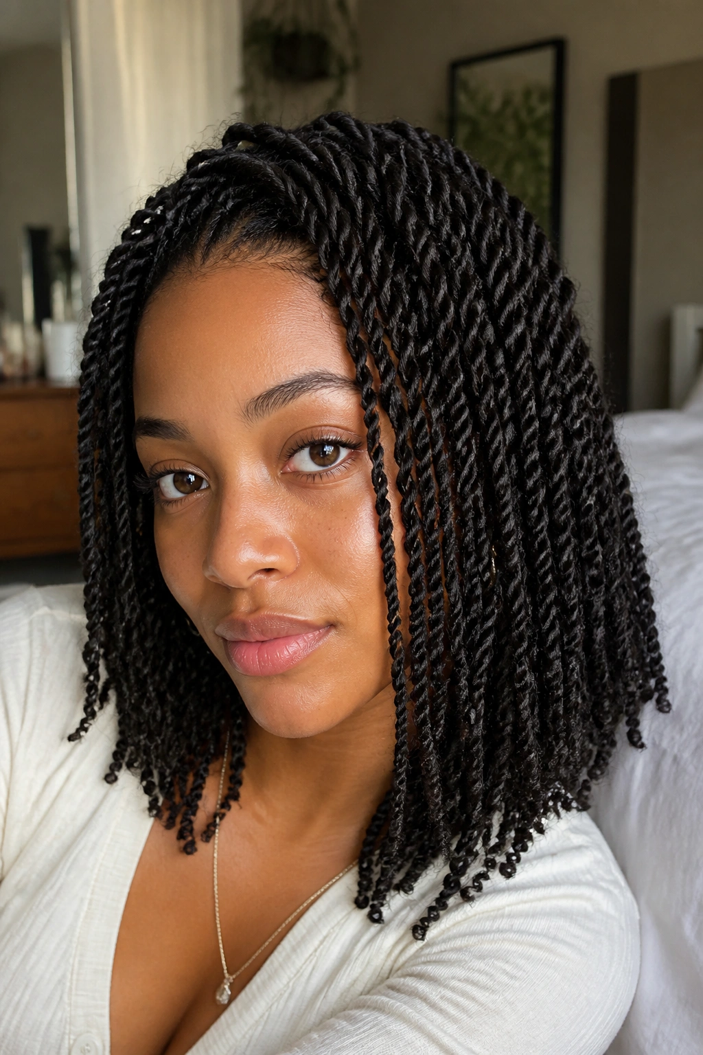 Close-up of a real woman with mini twists, showing texture and curl direction