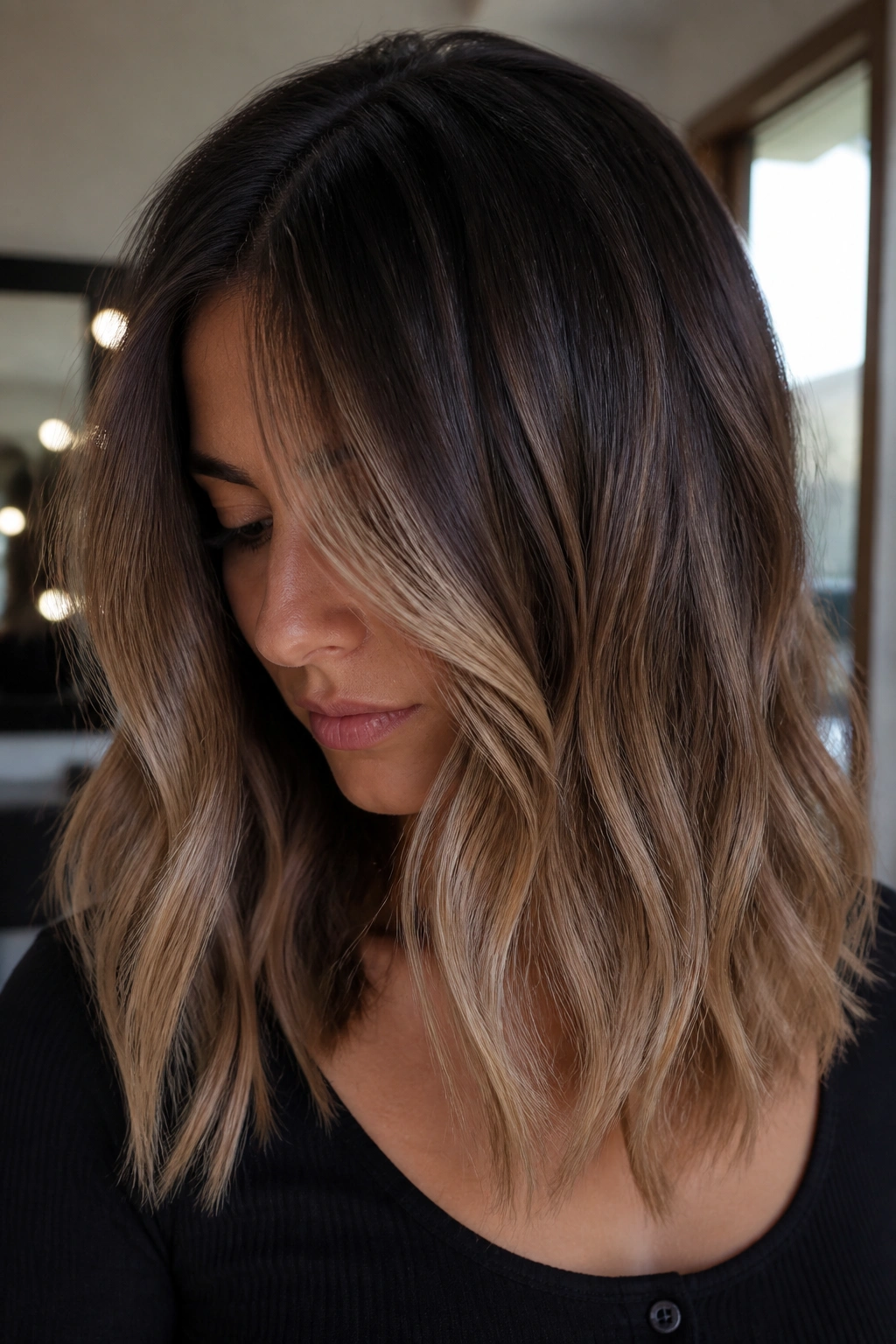 Close-up of dark hair with mocha bronde melt on a real person