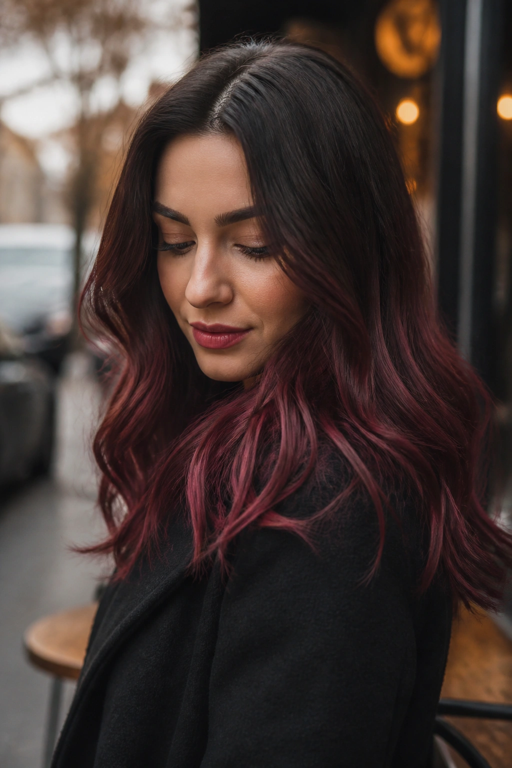 Close-up of a woman with mulled wine ombre hair