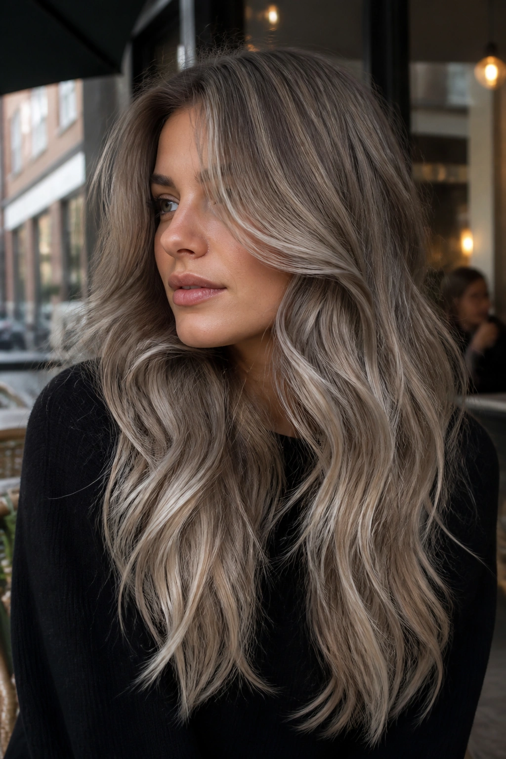 Close-up of a real woman with mushroom blonde melt in urban daylight