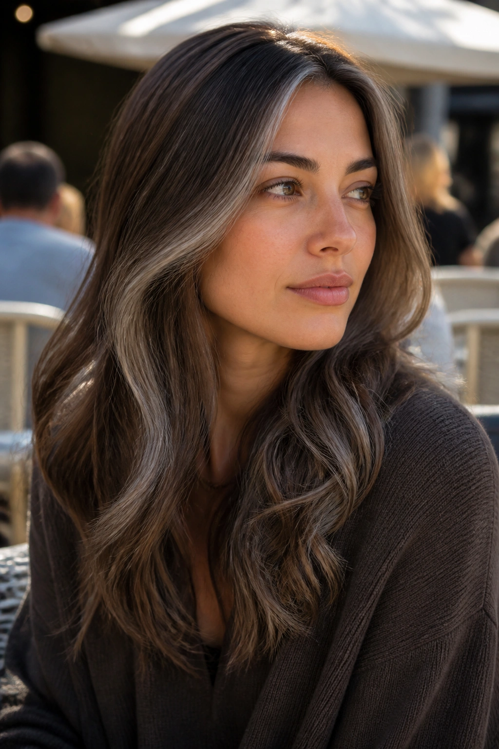 Close-up of mushroom brown hair with soft silver veils blending around the face