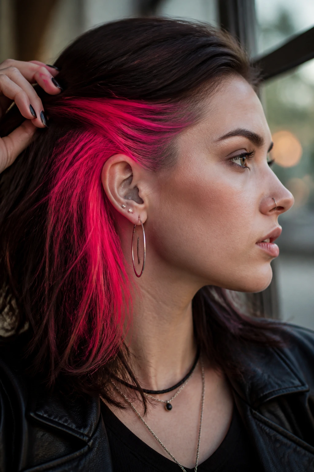 Close-up of a real person with neon pink peekaboo at the side above the ear