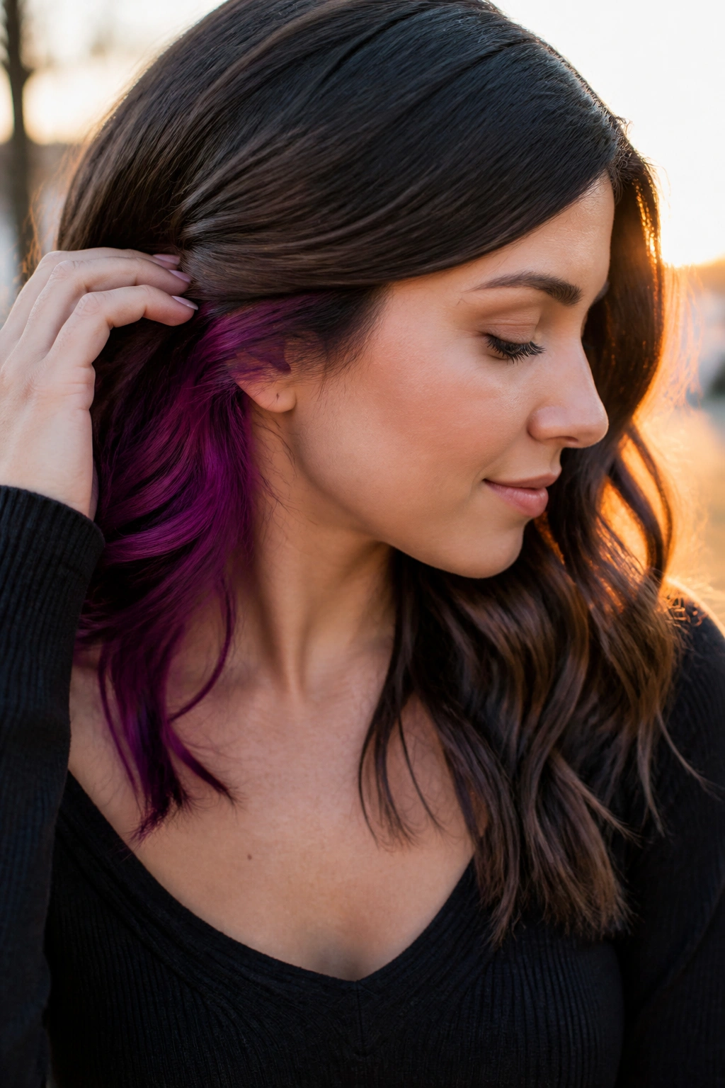 Real person with peekaboo color under top layer, visible when hair moves