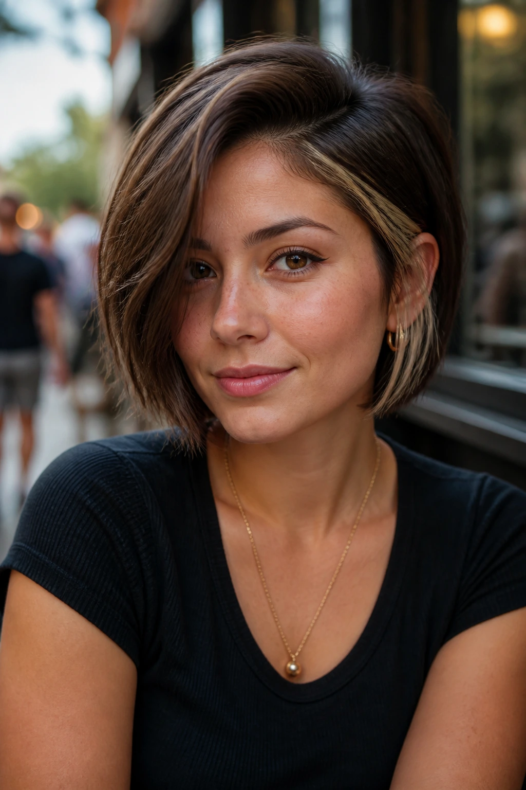 Asymmetrical short cut with peekaboo money piece visible at edge