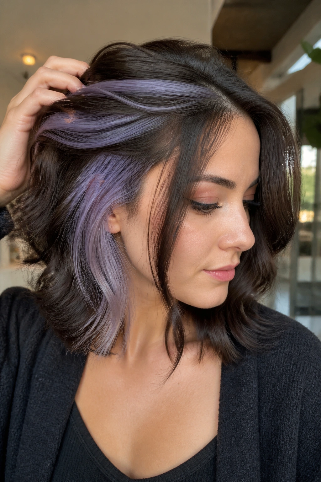 Close-up of a real woman with lilac-grey peekaboo panels peeking from under the top layer