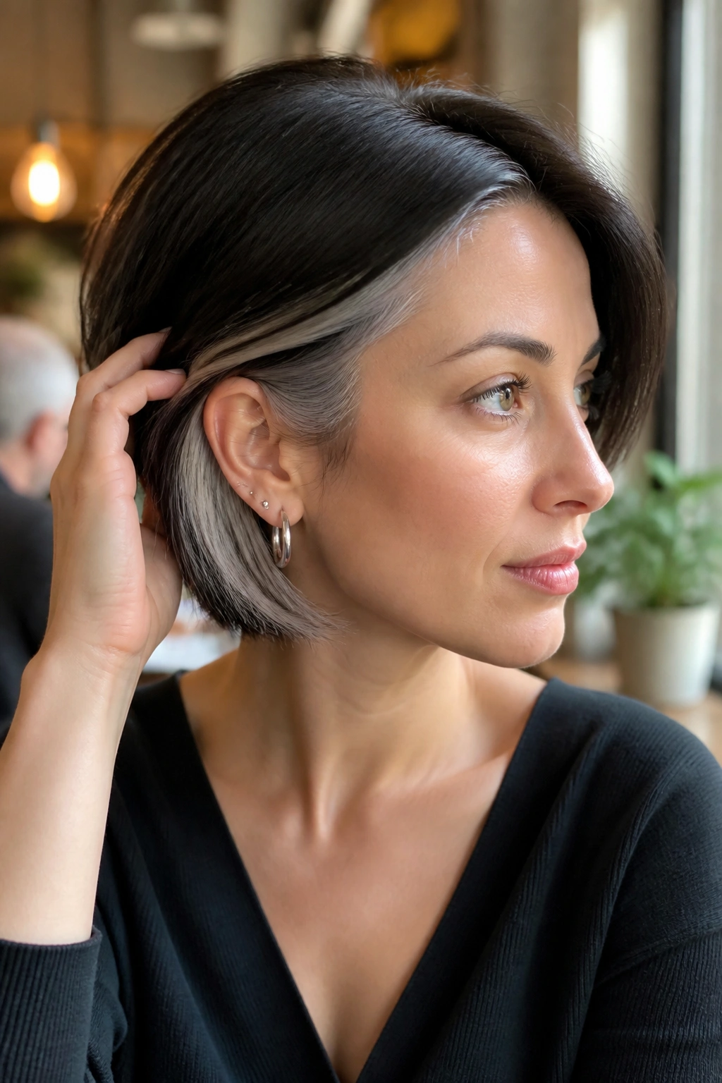 Portrait of a real person showing a darker top layer with a silver peekaboo underlayer.
