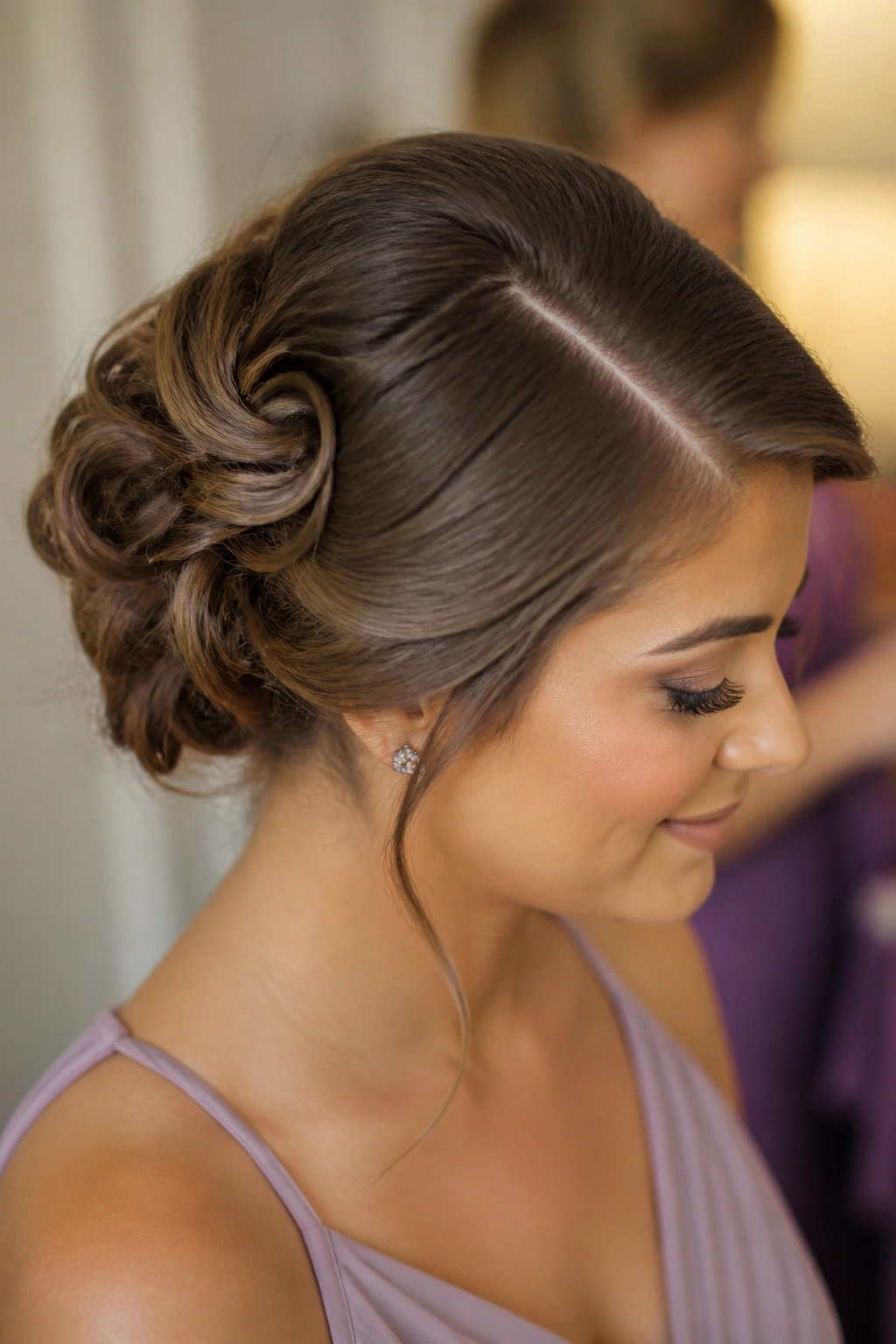 Close-up of real woman with pin-loop bun and deep side part