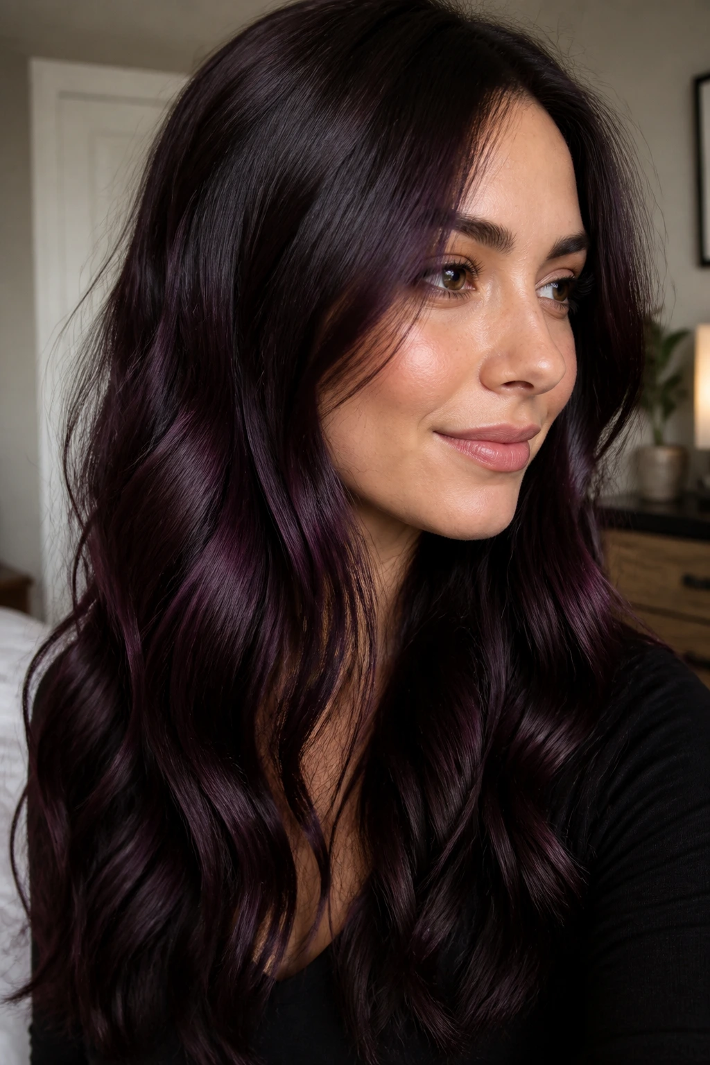 Close-up of a real woman's deep brown hair with plum undertone