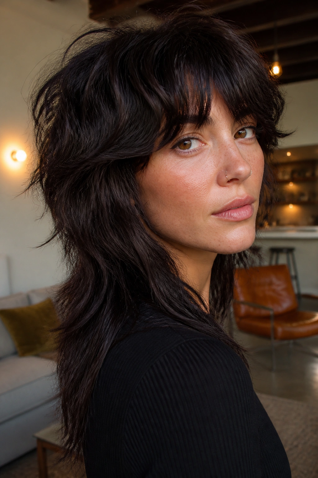 Portrait of a woman with razor-cut mullet shag on thick hair