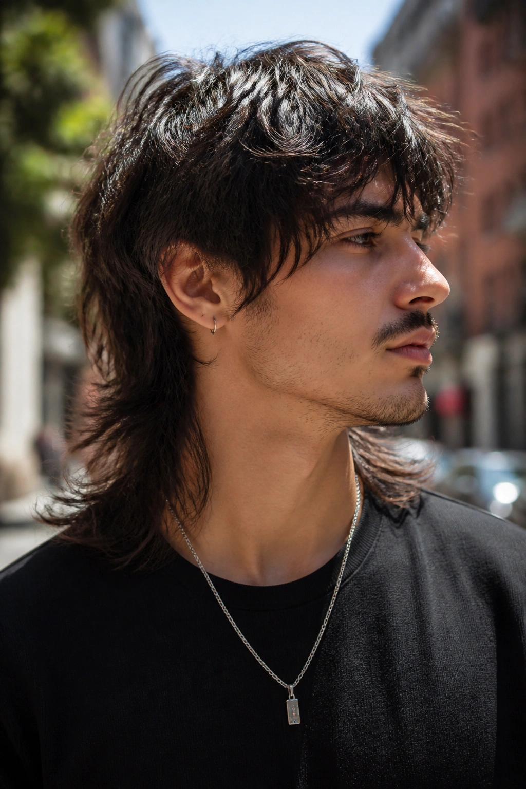 Man with razor-layered long mullet, feathered ends and movement