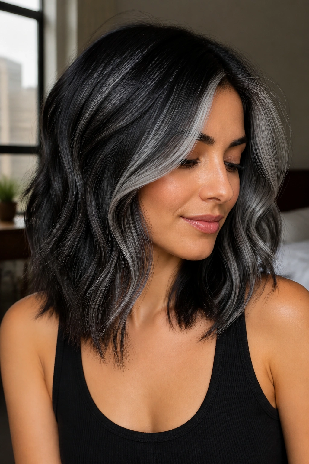 Portrait of dark hair with reverse silver highlights around the face