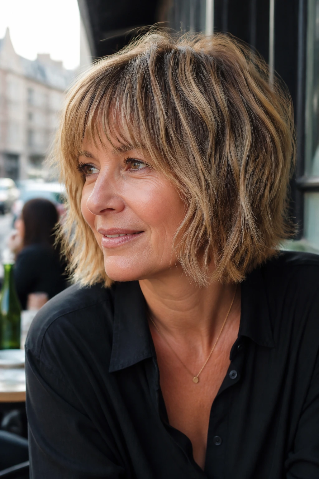 Real woman with shaggy bob and choppy ends showing texture and movement.