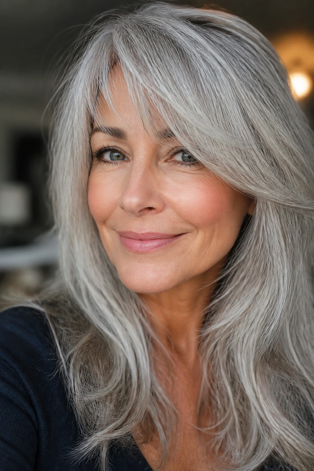 Close-up of silver hair with side-swept bangs framing the face