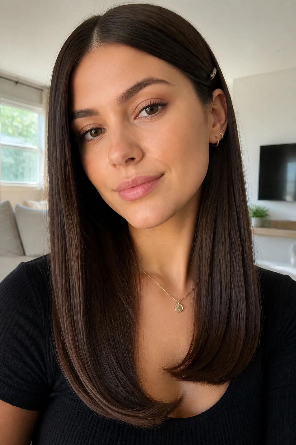 Close-up of real person with straight glossy hair and tucked-in ends