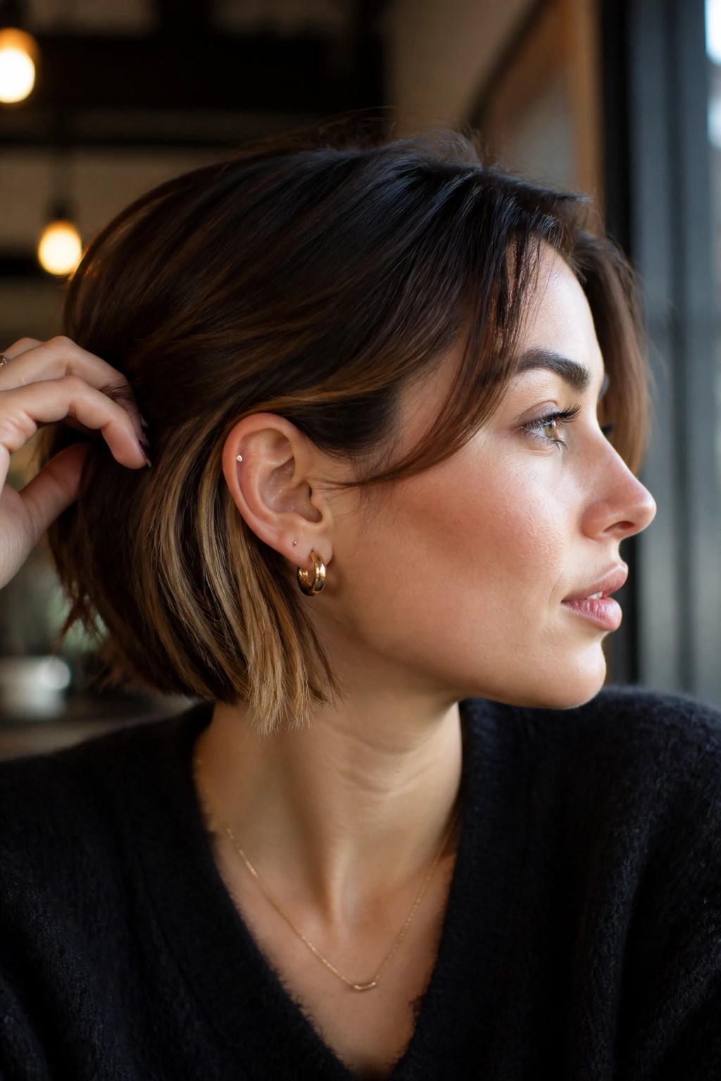 Behind-the-ear slice highlights on short hair