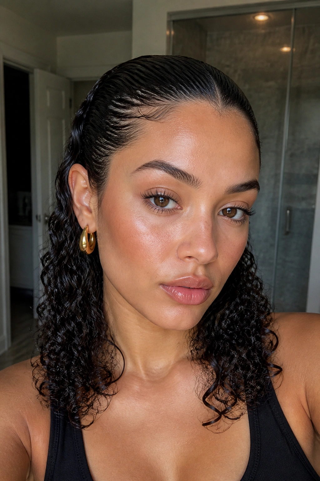 Real woman with slicked-back wet look curls