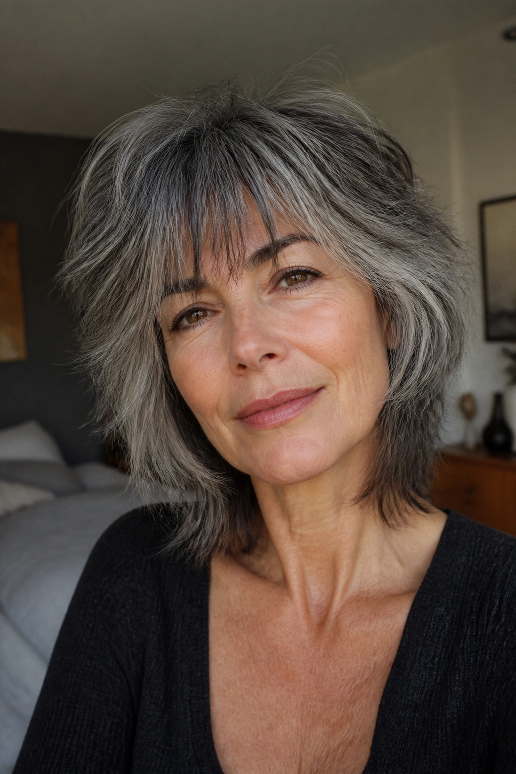 Close-up portrait of a real woman with soft shaggy hair and choppy ends in natural light