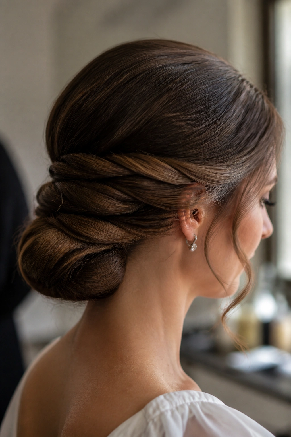 Close-up of a real woman with a soft wrapped twist hairstyle