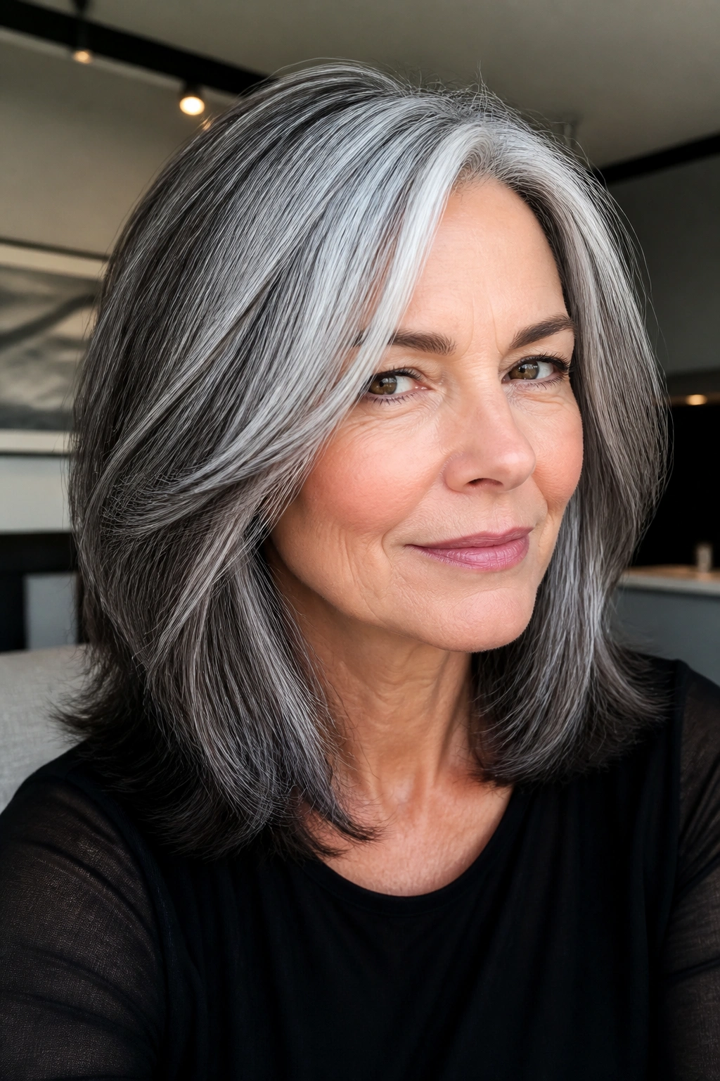 Close-up of steel grey and charcoal dimension on a real woman's hair