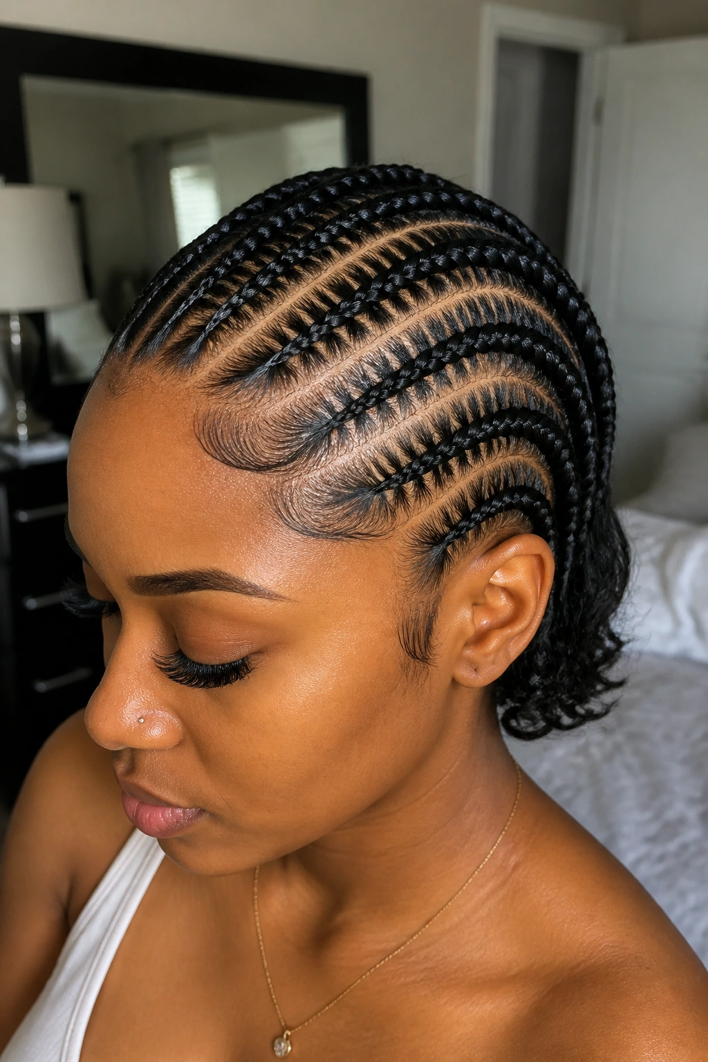 Close-up of a real person with stitch braids and sharp partings