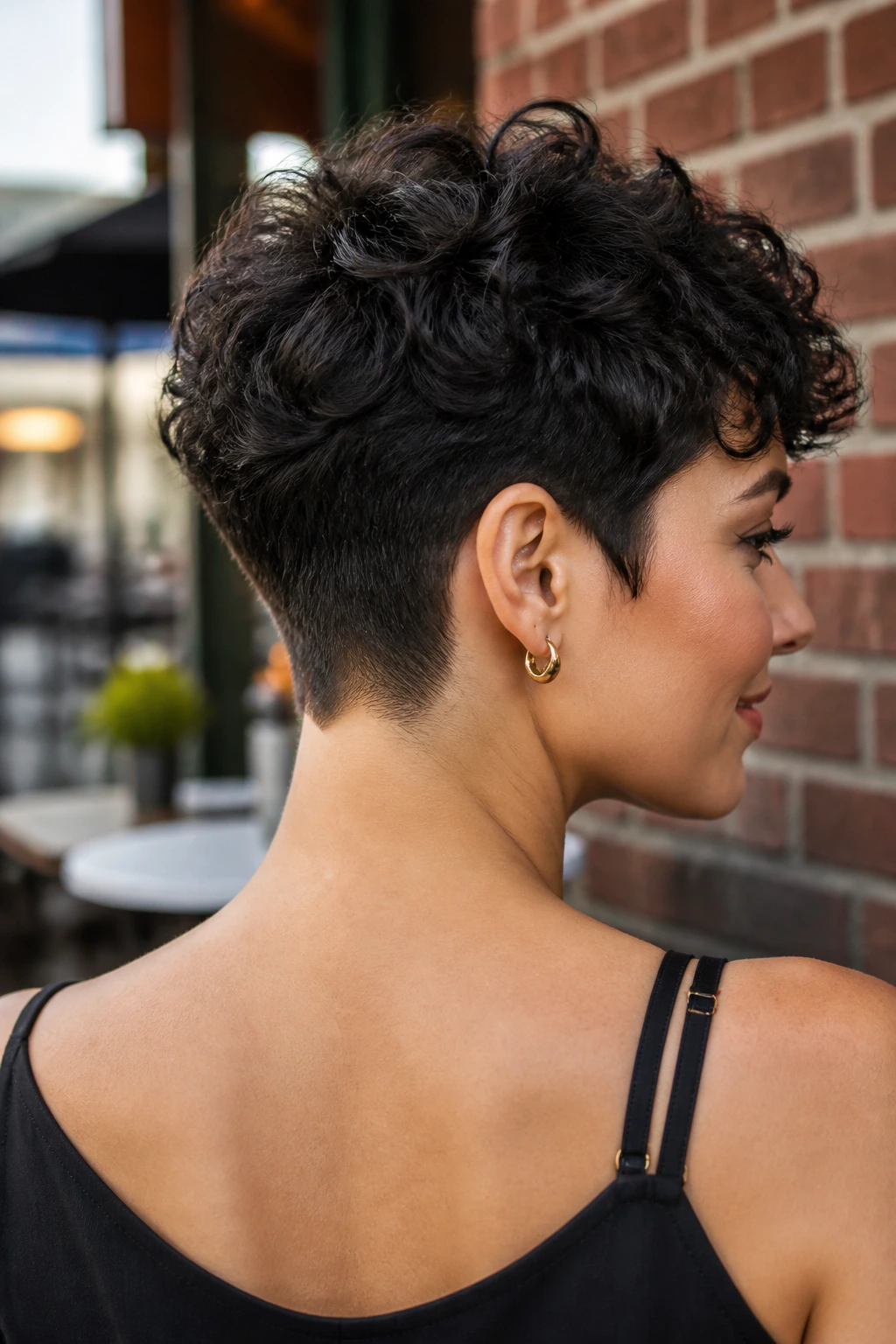 Portrait of a woman with tapered nape pixie showing clean neckline