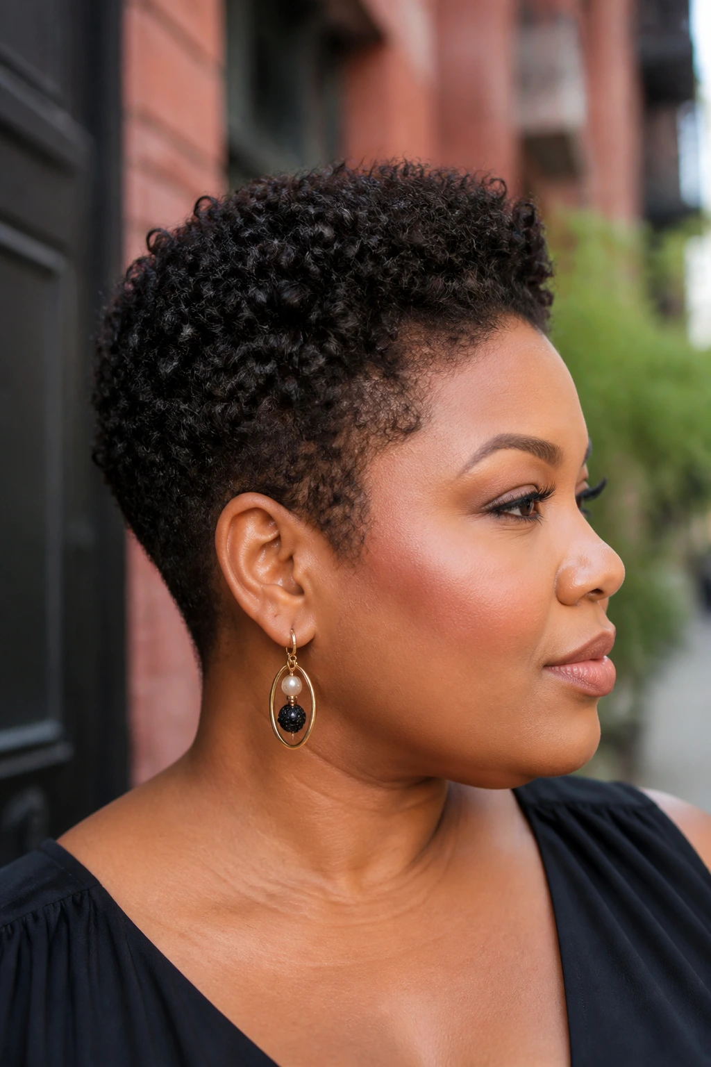 Real woman with tapered natural pixie cut outdoors in daylight