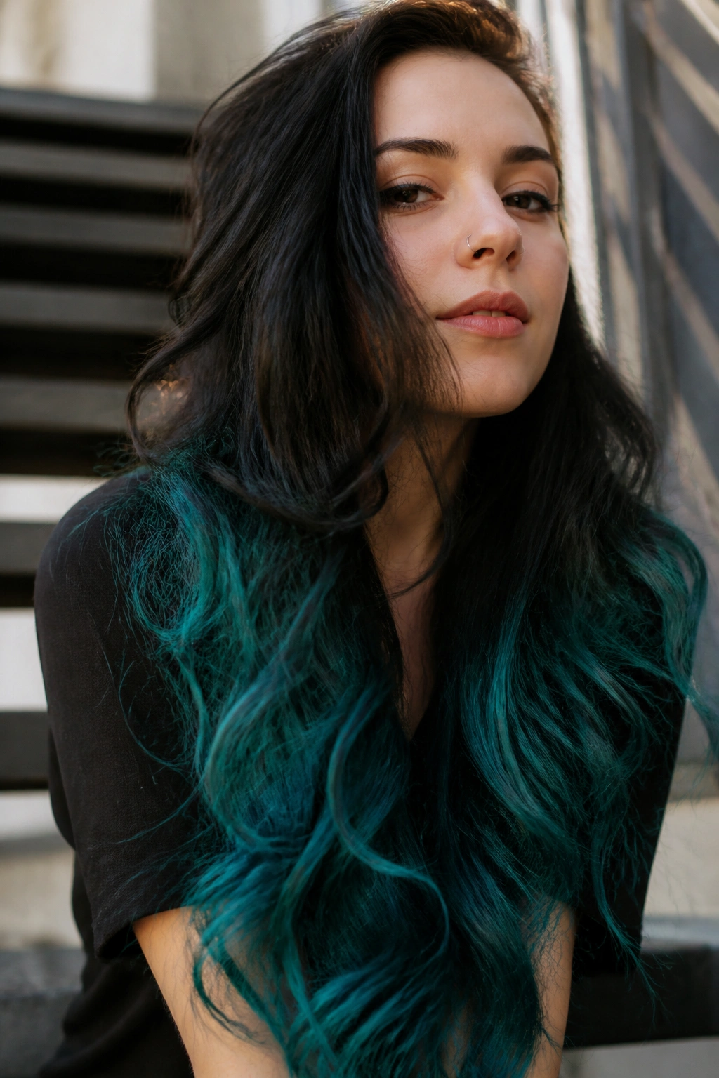 Close-up of real woman with teal dip-dye ends on long hair