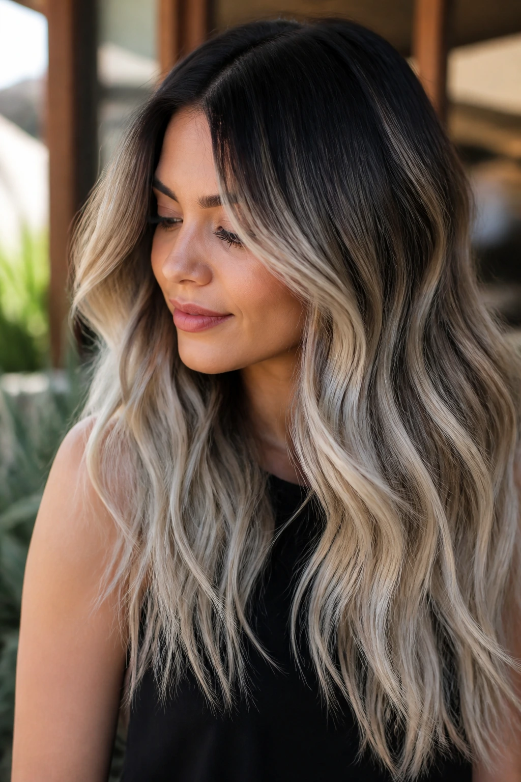 Real person with toasted coconut balayage dark roots to icy blonde