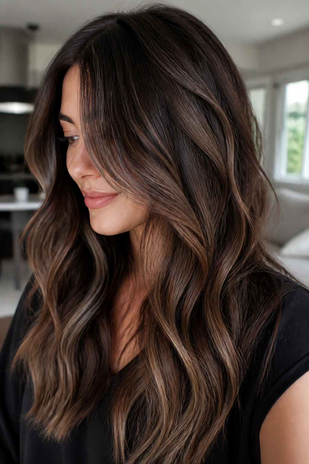 Close-up of long hair with walnut balayage in bright natural light
