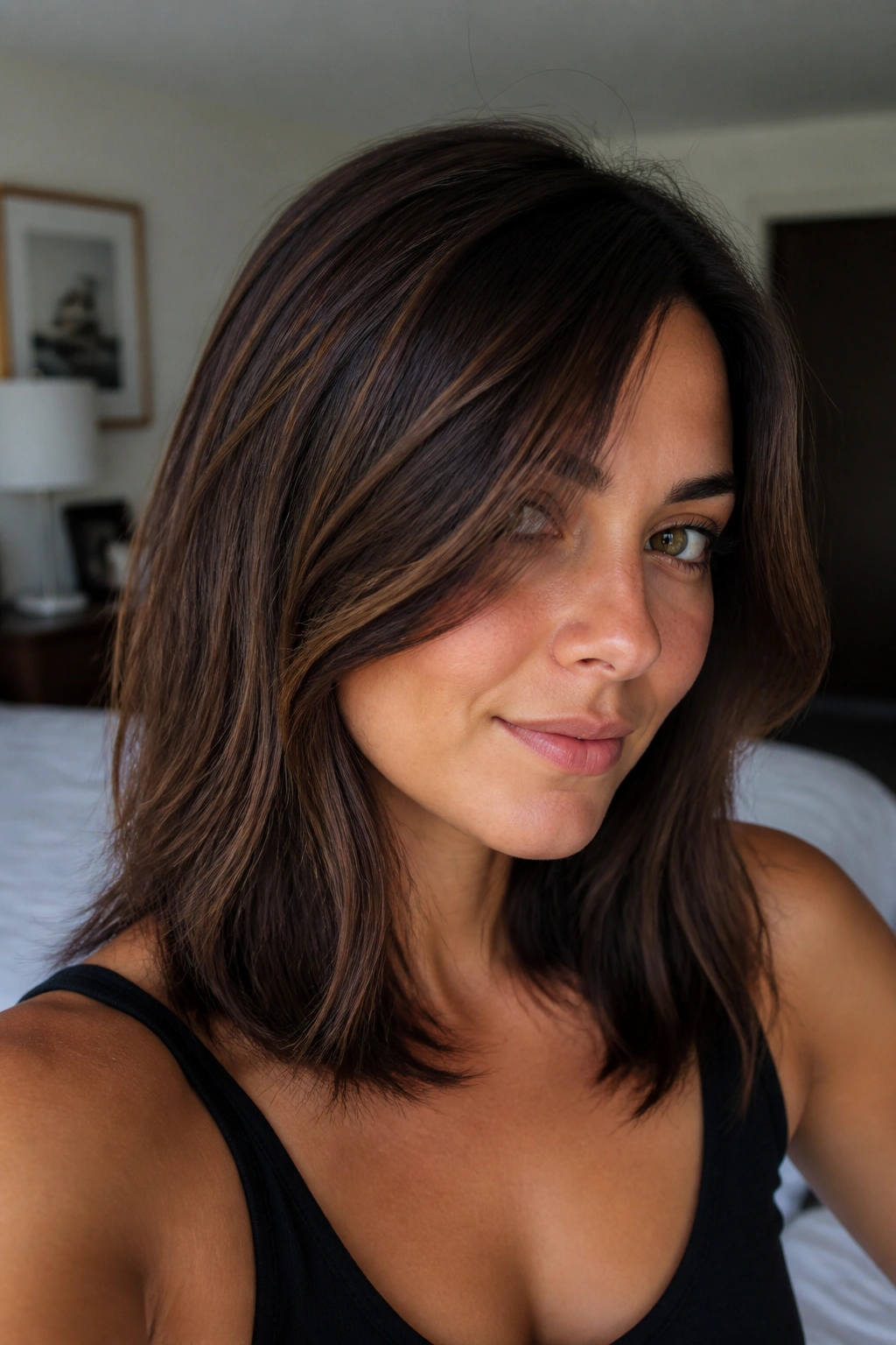 Close-up of walnut brown hair with fine babylights on a real person.