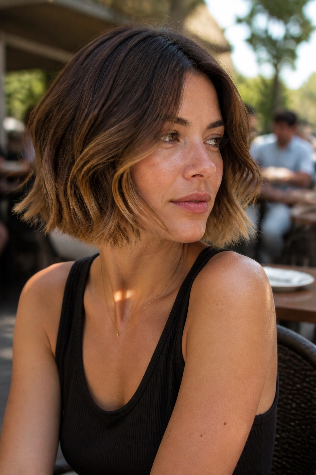 Portrait of a real woman with walnut brown hair and honey ends in natural light.